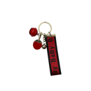 Keychain with red accents and 'Baby' tag on a white background